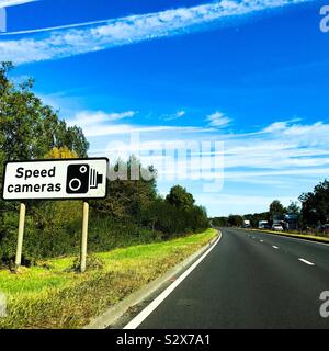 Speed limit sign on a dual-carriageway road indicating a speed limit of ...