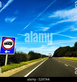 A 7.5 Ton maximum weight transportation lorry dual carriageway sign on the grass verge side of a major road route Stock Photo