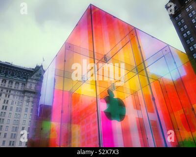 The iconic Apple store cube on fifth Avenue is located across from the famous plaza hotel and wrapped in a temporary iridescent wrap, NYC, USA Stock Photo