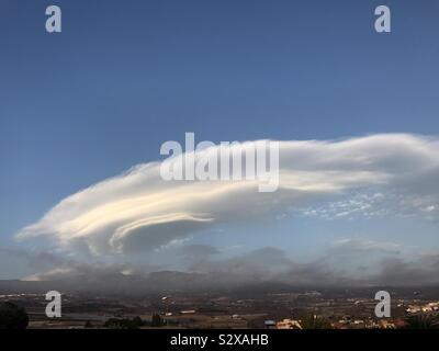 Lenticular cloud formation in the sky above mont Teide volcano on Tenerife, Canary Islands, Spain Stock Photo