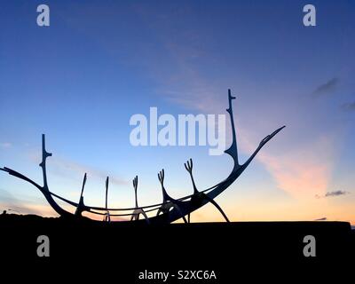 Reykjavik boat sculpture silhouette at sunset “sun voyager”, or Sólfar, on the waterfront in Iceland Stock Photo