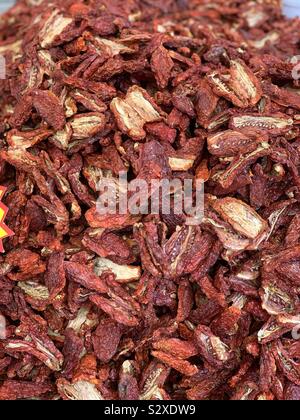 Sun dried tomatoes at a vegetables market of Catania, Sicily, Italy Stock Photo