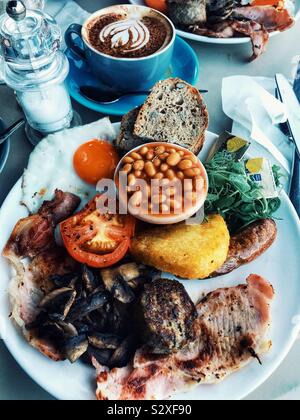 Full English Breakfast Fry Up and A Cappuccino with Heart Art Stock Photo