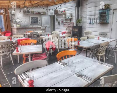 Empty Restaurant Before Opening, Tables all Laid Ready For Service Stock Photo