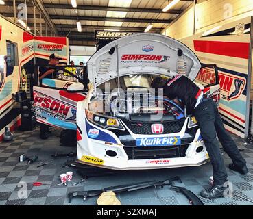 Pit Garage Of Matt Simpson With Mechanics Working On His Car At The BTCC At Silverstone UK 2019 Stock Photo