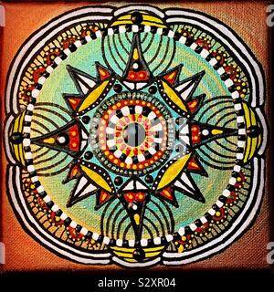 Golden mandala design on canvas. Stock Photo
