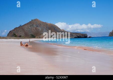 sunbathing in Pink Beach Komodo island Stock Photo