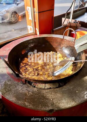 Deep frying Banana chips in Kerela, India. Stock Photo