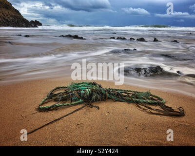 Old rope washed up on a Welsh surf beach, Gower, Wales, October. Stock Photo