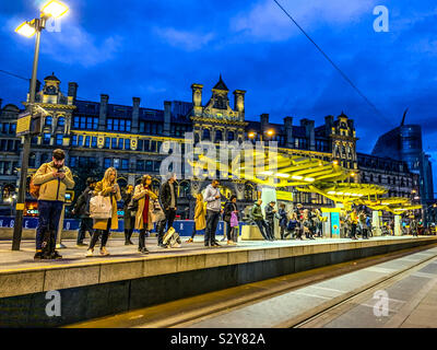 Exchange Square tram stop in Manchester at dusk Stock Photo