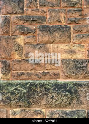 Old smoky stone wall full of character Stock Photo