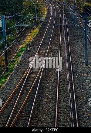Railway track with electric overhead cables, Ayrshire, UK Stock Photo