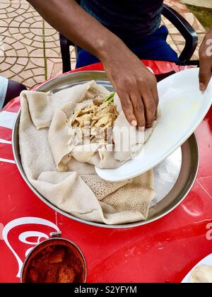 Enkulal be tibs firfir is a traditional Ethiopian breakfast. Stock Photo