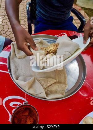 Enkulal be tibs firfir is a traditional Ethiopian breakfast. Stock Photo