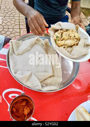 Enkulal be tibs firfir is a traditional Ethiopian breakfast. Stock Photo