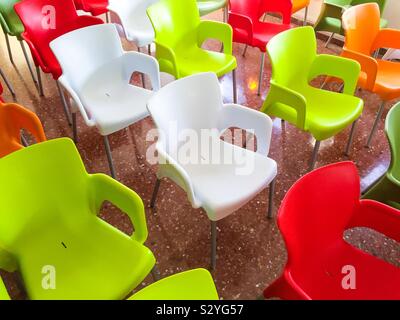 Colored chairs in a room Stock Photo