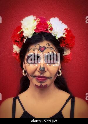 A young woman with her face painted like a catrina dresses up for a Halloween party in Ajijic, Mexico. Stock Photo