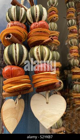 Autumn colourful scented fragrance ornaments : scotch bonnets, limes, cinnamon sticks, oranges Stock Photo