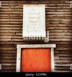 Sign over a door at the Richard Sparrow House, the oldest wooden house still standing in the town of Plymouth, Massachusetts, USA. RIchard Sparrow built the house around 1640. Stock Photo