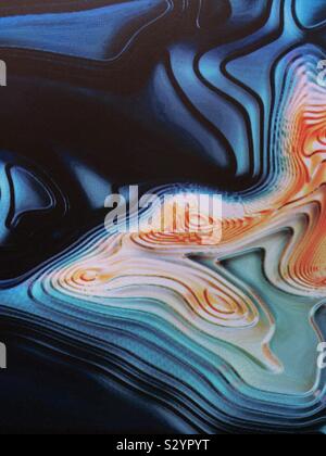 Abstract of swirling colorful patterns on a lighted wall Stock Photo