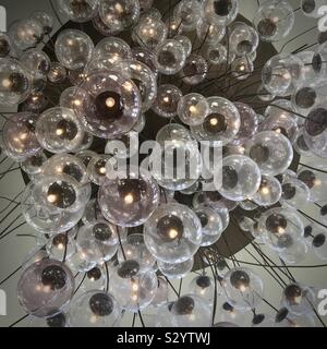 Dozens of light bulbs creating an abstract pattern Stock Photo