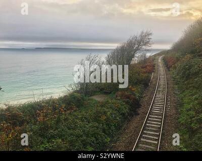 Railway line leading along the coast from St Ives, Cornwall. Stock Photo