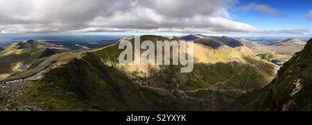 Panoramic view of Snowdonia mountains and valleys from the Summit of Snowdon on a bright sunny day Stock Photo