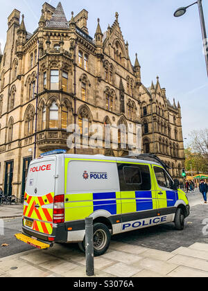 Greater Manchester police van parked next to central street and Albert Square in Manchester City centre Stock Photo