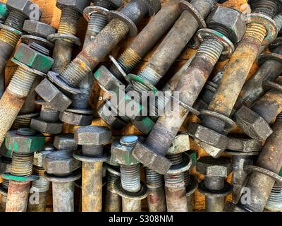 A flat lay collection of large bolts washers and nuts seen from above. Stock Photo