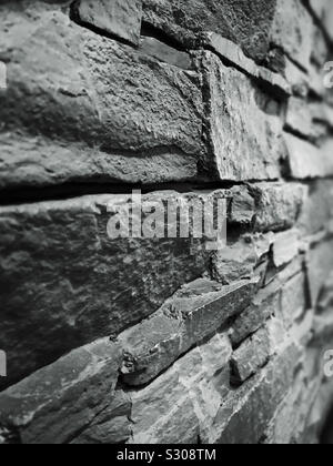 Stone wall in black and white.  Detail and texture Stock Photo