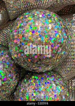 Silver disco ball Christmas ornament covered with colorful glitter Stock Photo