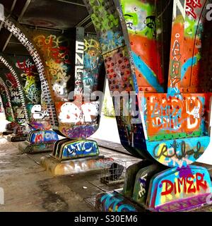 Graffiti tagging on steel bridge supports, Vienna, Austria. Stock Photo