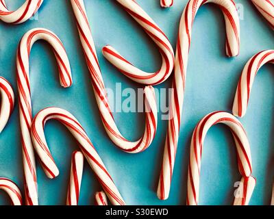 Candy canes on a blue background Stock Photo