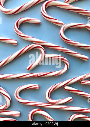 Candy canes on a blue background Stock Photo