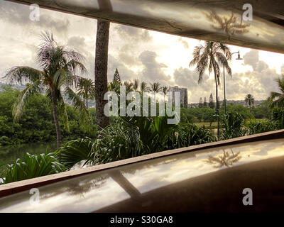 Tropical landscape seen through a tapering window Stock Photo