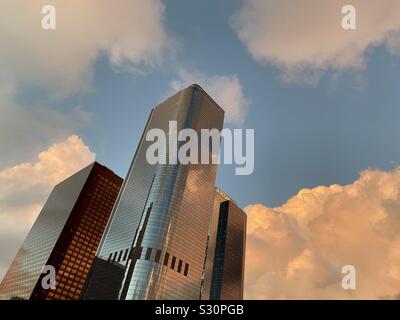 LOS ANGELES, CA, NOV 2019: looking up at skyscrapers in California Plaza at sunset, with copper orange clouds, in the Financial District of Downtown Stock Photo