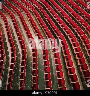 Rows of unoccupied seats in an empty theatre