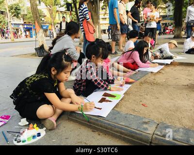 Vietnamese school children painting in Hanoi Stock Photo