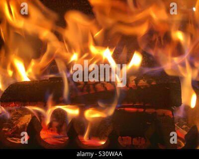 Burning logs on a Woodburner Stock Photo
