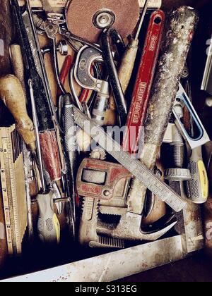 Selection of wood working tools in a workshop. Hammers, clamps, screwdrivers and sanders. Stock Photo