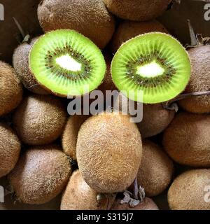 Funny face made with Kiwi fruits. Stock Photo