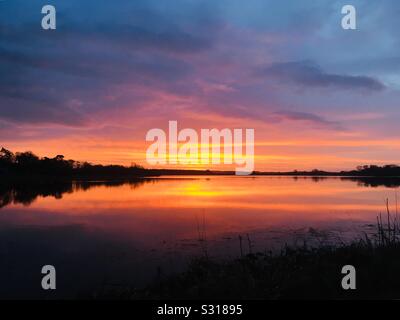 January sunrise over Castle Loch, Lochmaben, Dumfries and Galloway, Scotland Stock Photo