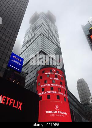 The NASDAQ building in times square on a foggy evening, NYC, USA Stock Photo