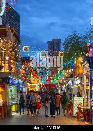 Street scene during Chinese New Year celebrations in Chinatown Singapore. In the evening January 2020 with CNY lights and decorations Stock Photo