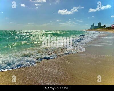 Miami Beach Florida- Classic Ocean Sand with rippling crystal clear waves Stock Photo
