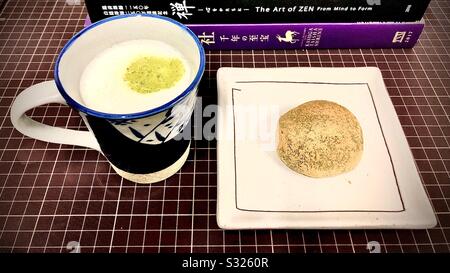 Tea time in Japan: matcha latte and daifuku sweet bean paste cake Stock Photo
