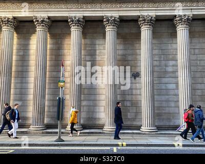 People walk past the Bank of England in London, January 2020 Stock Photo