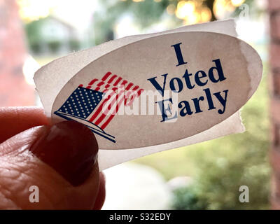 I voted early sticker on a middle aged woman’s finger Stock Photo