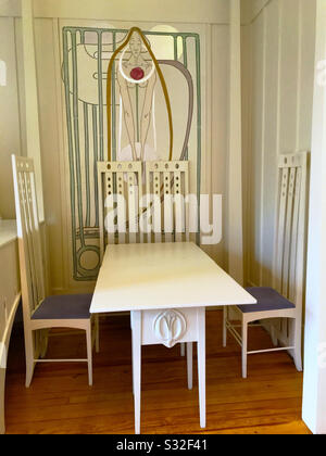 Table in the Music room of House for an Art Lover in Bellahouston Park, Glasgow, Scotland. Built in 1996 from plans drawn up by Charles Rennie Mackintosh in 1901. Stock Photo