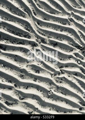 The tide at Ryde beach has gone out and left these ripples in the sand - Isle of Wight Stock Photo